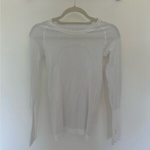 Lululemon white long sleeved tee. Size 2. Perfect condition.